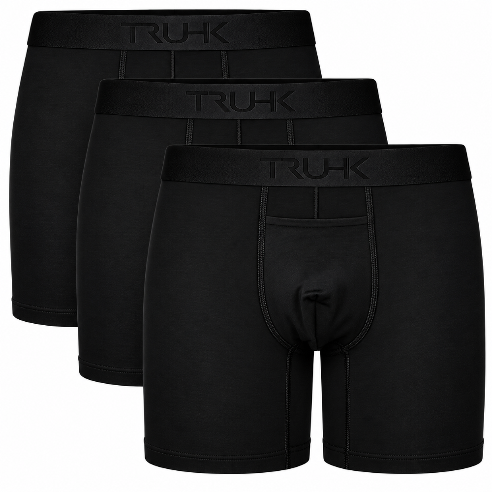 Three pairs of black boxer briefs shown in a staggered stack, with the front pair displaying a rear pocket and the waistband embossed with the brand name 'TRUHK'.