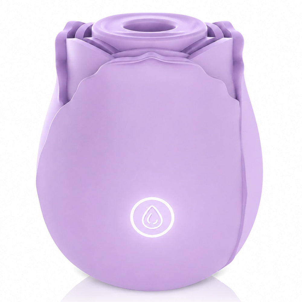 Nexus Vibe Petalpulse lilac silicone vibrating rose airpulse suction toy from the side, with power button lit up