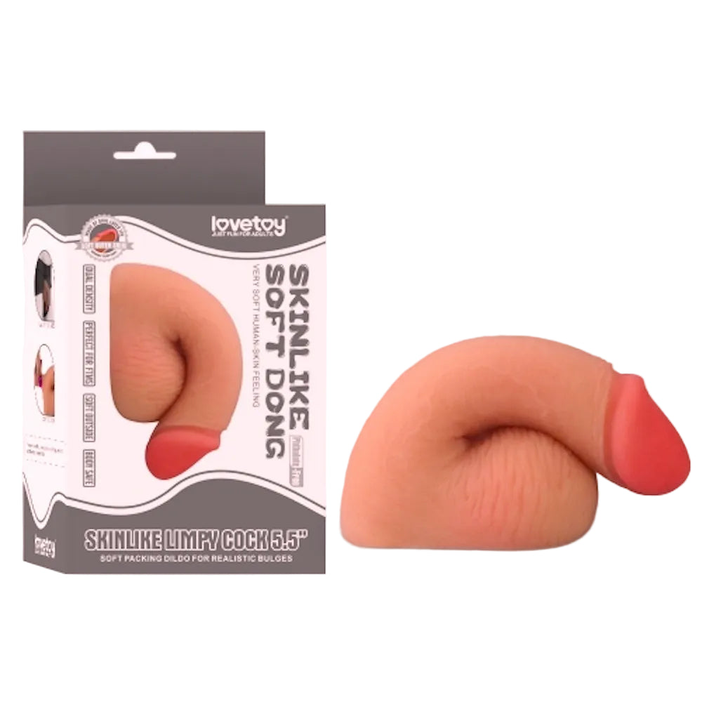 Love toy 5.5 inch dual layer TPE packing penis form the side in a flaccid position  sitting next to its box