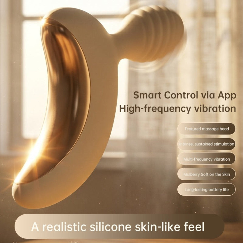Lunar Curve silicone crescent moon shaped clitoral vibrator in white and gold with app control capability, from the side with vibration turned on