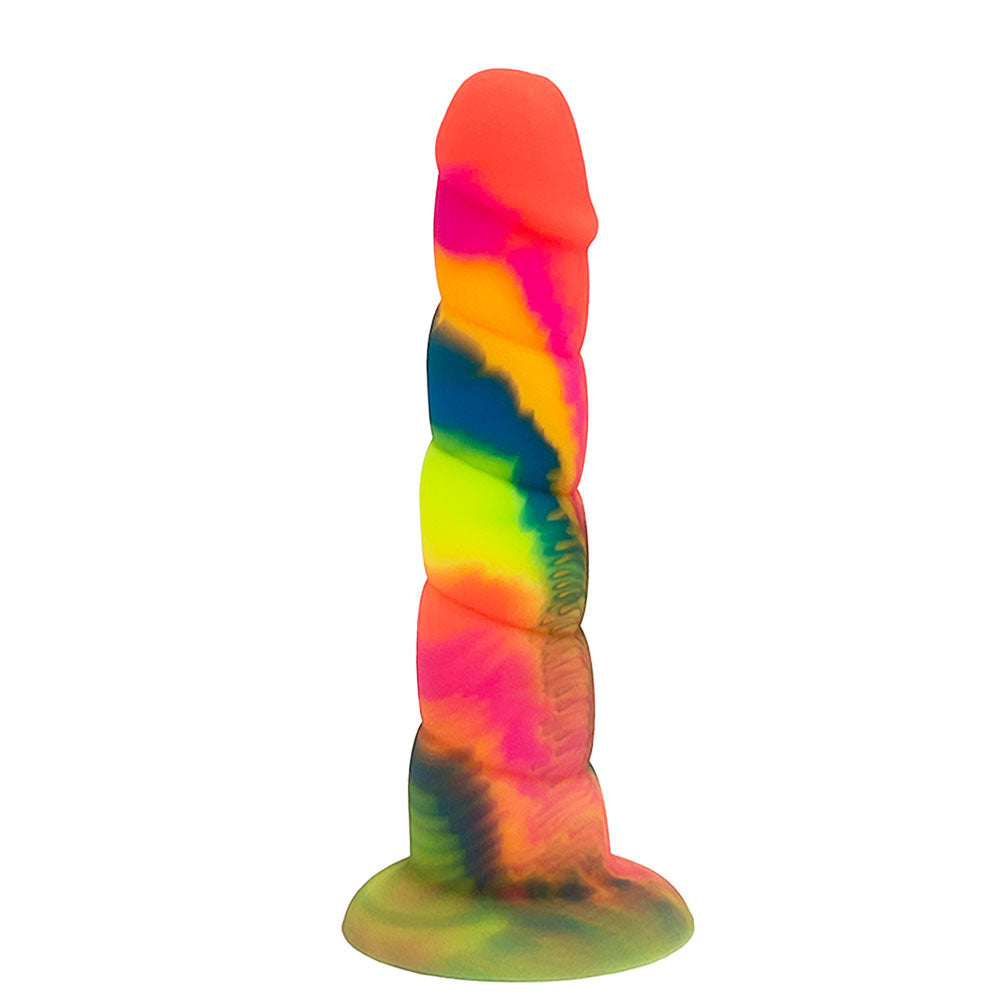 Nexus Loli 6 inch silicone horn dildo in rainbow tie dye colors, flat on its base, form the side