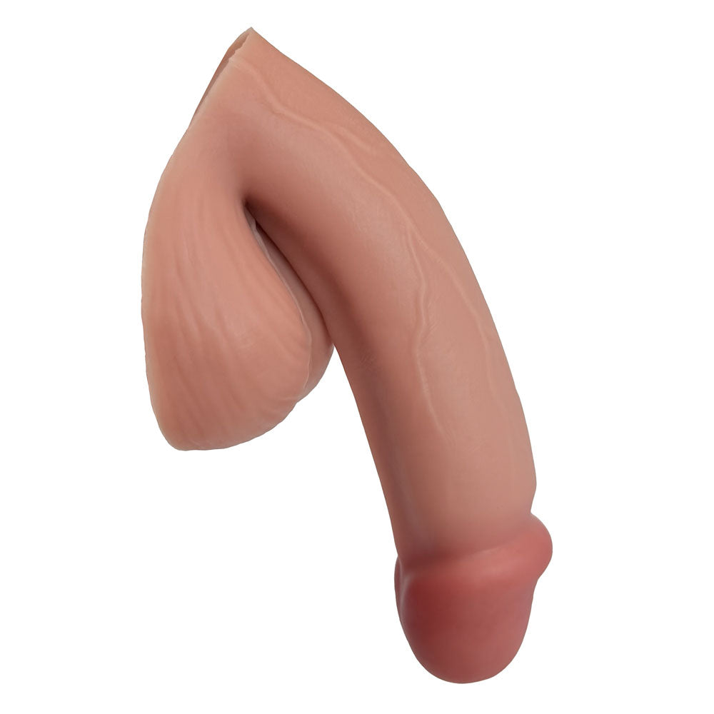CARAMEL SILICONE VECTOR 5 INCH FTM SILICONE PACKER, FROM THE SIDE IN THE PACKED FLACCID POSITION