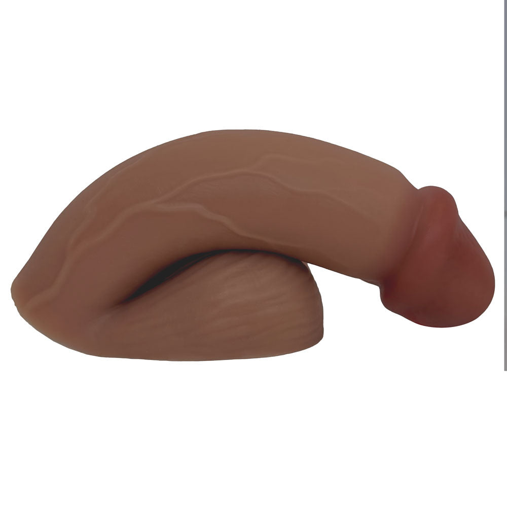 MOCHA SILICONE VECTOR 5 INCH FTM SILICONE PACKER, FROM THE SIDE IN THE PACKED FLACCID POSITION, FLAT ON ITS BASE