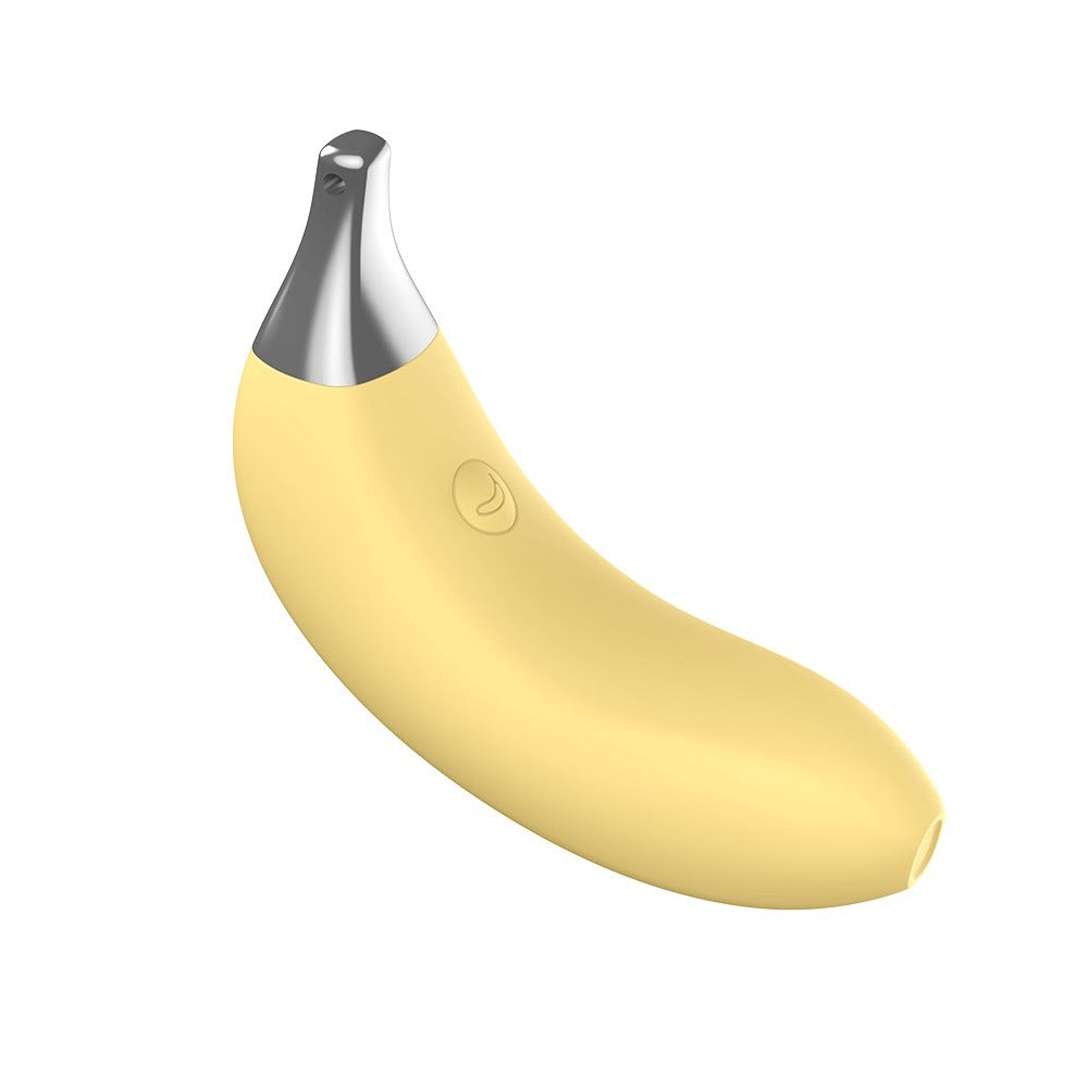 Top banana silicone banana shaped mini vibrator from the side, with power button showing