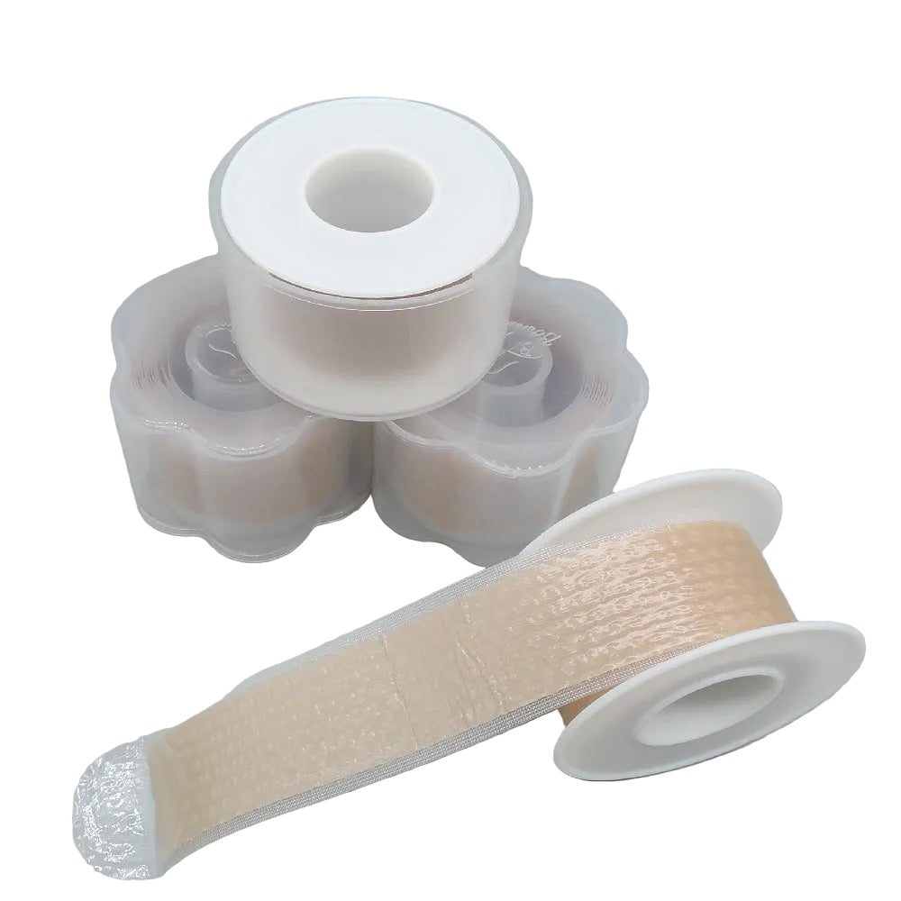 unique silicone scar tape, stacked in containers and a roll unraveling to show twxture