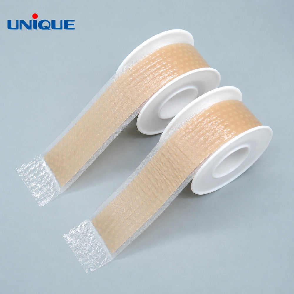 Unique silicone scar care tape, two rolls on gray back ground
